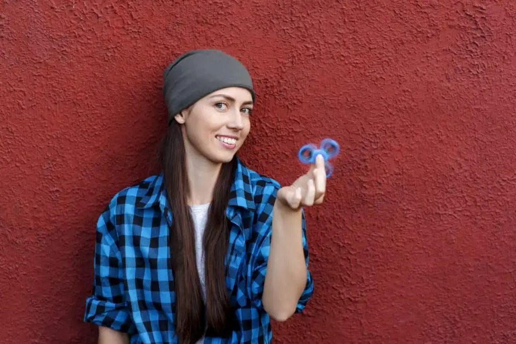 girl playing with fidget spinner - Do Calories Matter on Keto or Just Carbs