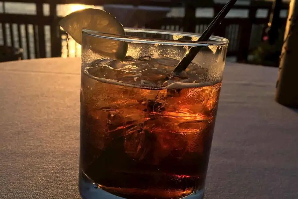 Jack and Coke at sunset on the waterfront in downtown - Can You Drink Alcohol On Keto