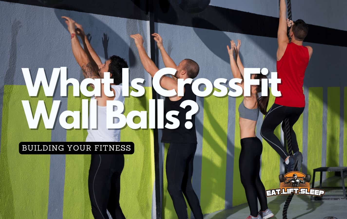 Crossfitters doing wall balls and rope climbs
